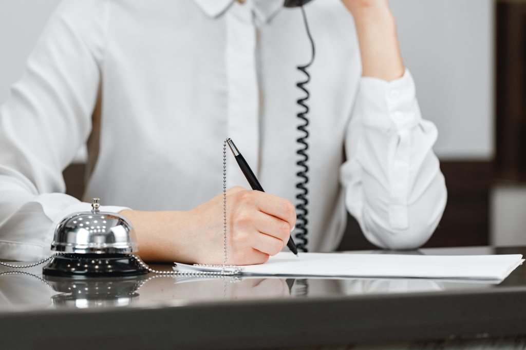 Close up photo of modern hotel reception counter desk