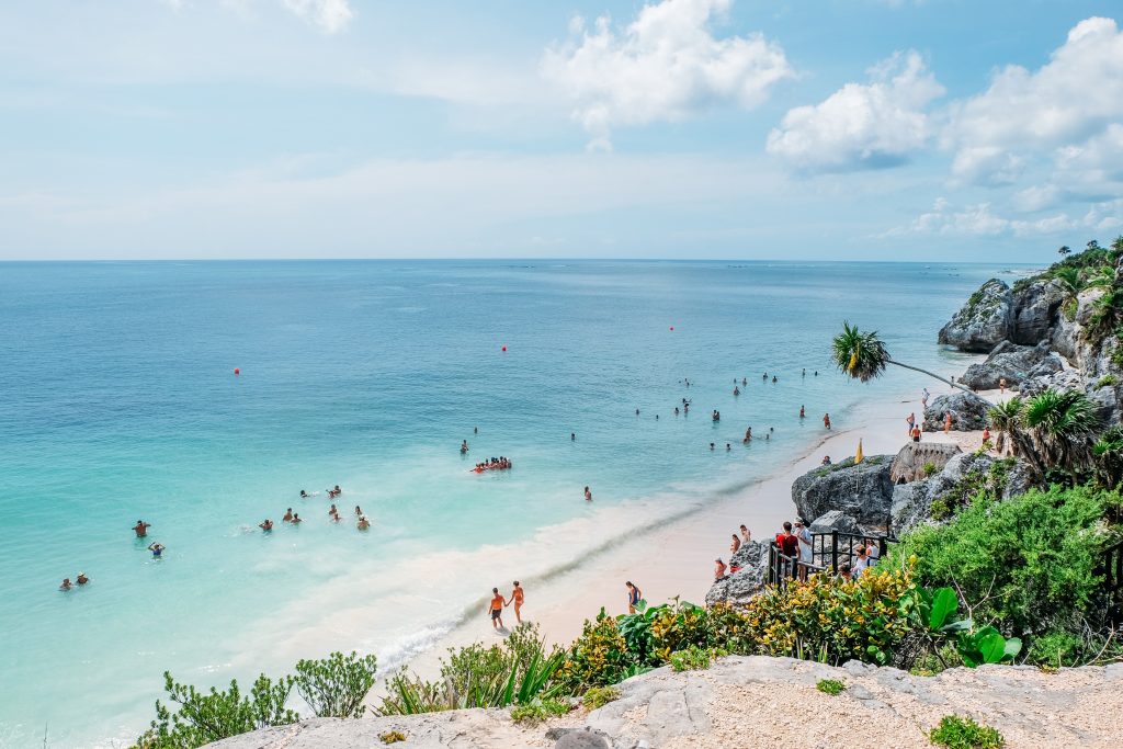 Tulum beach in Mexico during the summer with people
