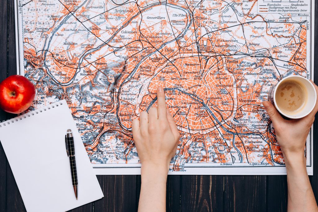 Top View of a map and items. Map of the world. Travel, tourism and vacation concept background.