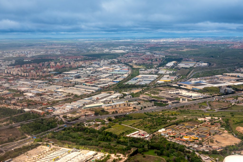 Aerial view from airplane of a town village and lands.