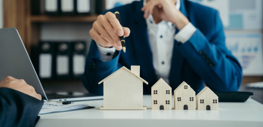 Home Insurance and Real estate investment concept,  new client after signing agreement contract with approved property application form.