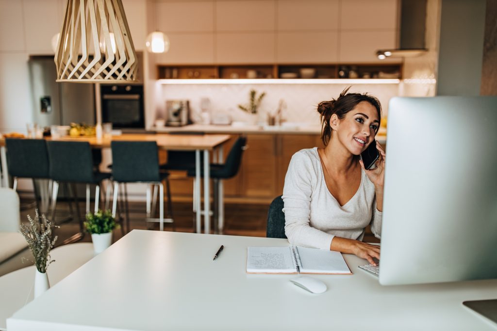 Relaxed woman enjoying at home, browsing something online.