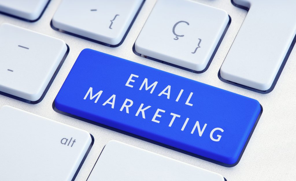 Email Marketing concept. Phrase on blue computer Keyboard Key